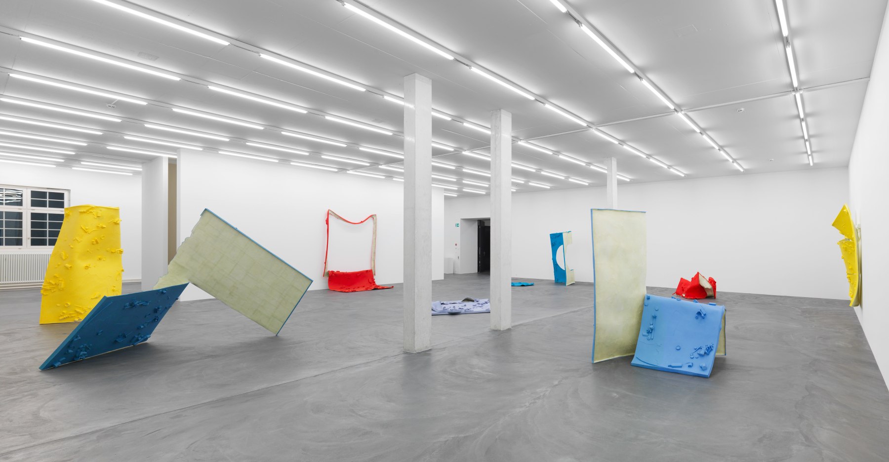 Installation view of Alex Hubbard sculptural paintings and film exhibition
