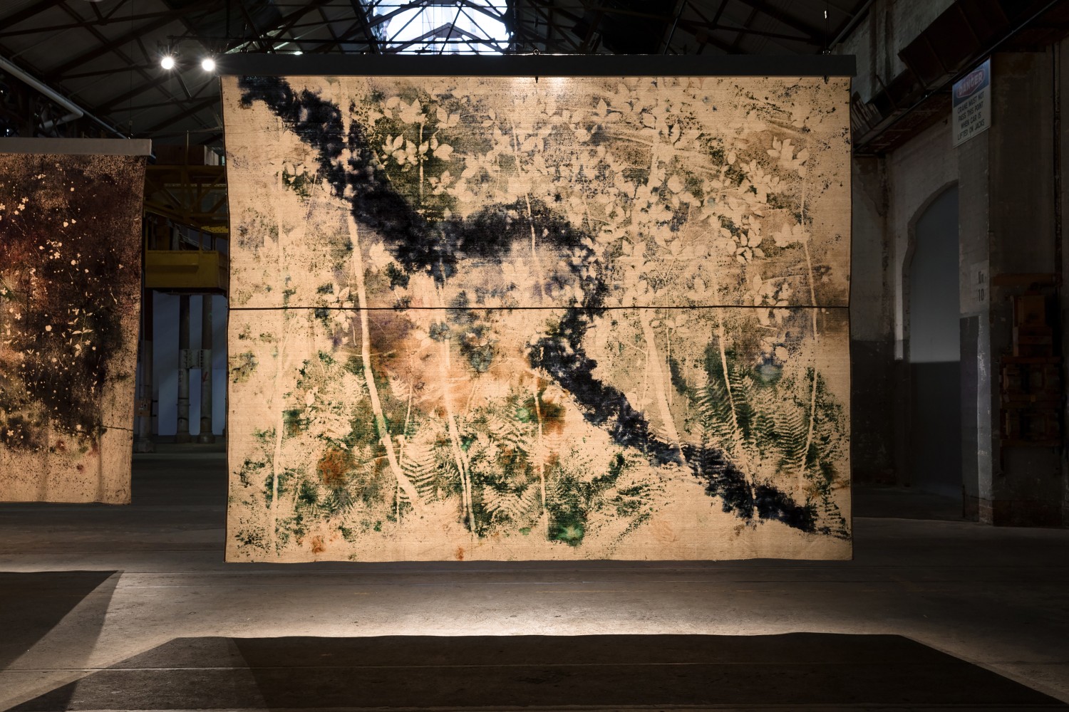 Installation view of paintings by Sam Falls