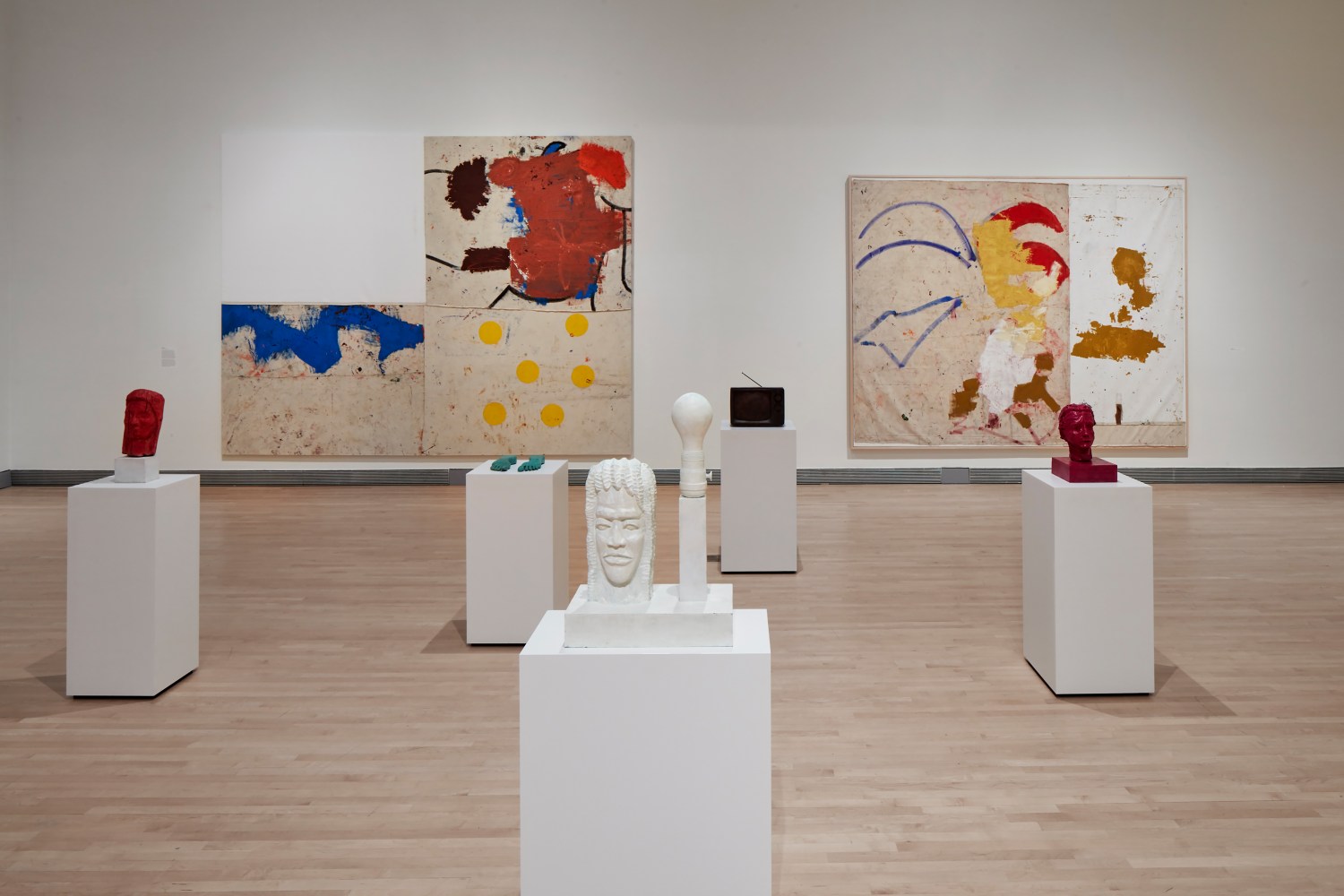 Installation view of paintings and sculptures by Joe Bradley