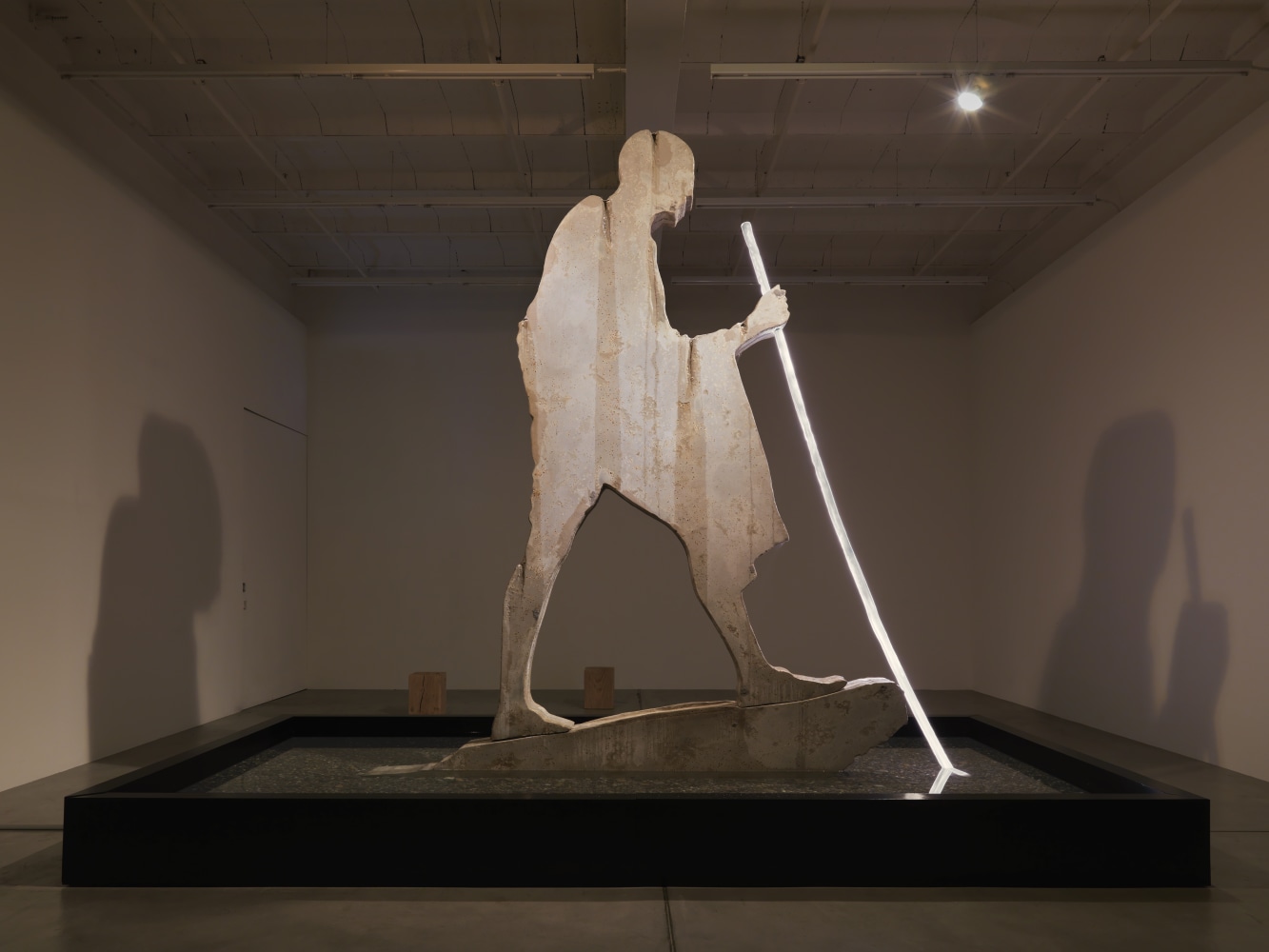 Sculptural installation by Doug Aitken, Crossing the Border 2018 Choreographed light sculpture and synchronized water fountain, steel, wood, fiberglass, stone, concrete 3.71 x 3.39 x 4.57 m / 12.17 x 11.12 x 14.99 feet