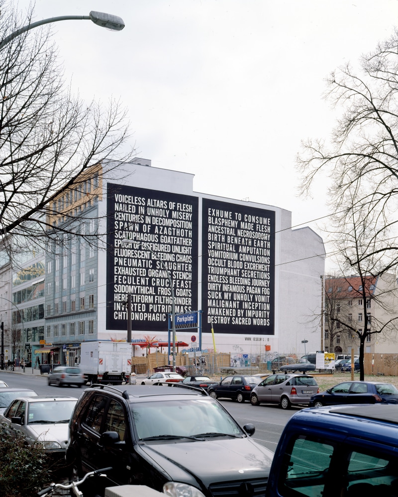 Installation view of outside wall work by Steven Shearer