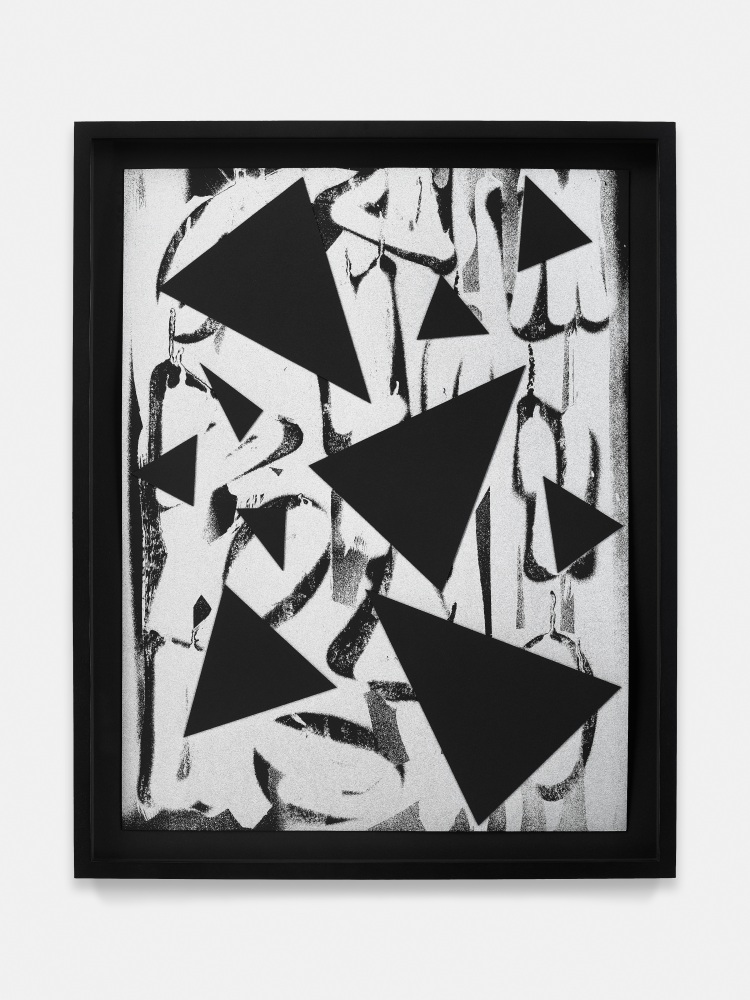black and white collage of triangle and round shapes on paper