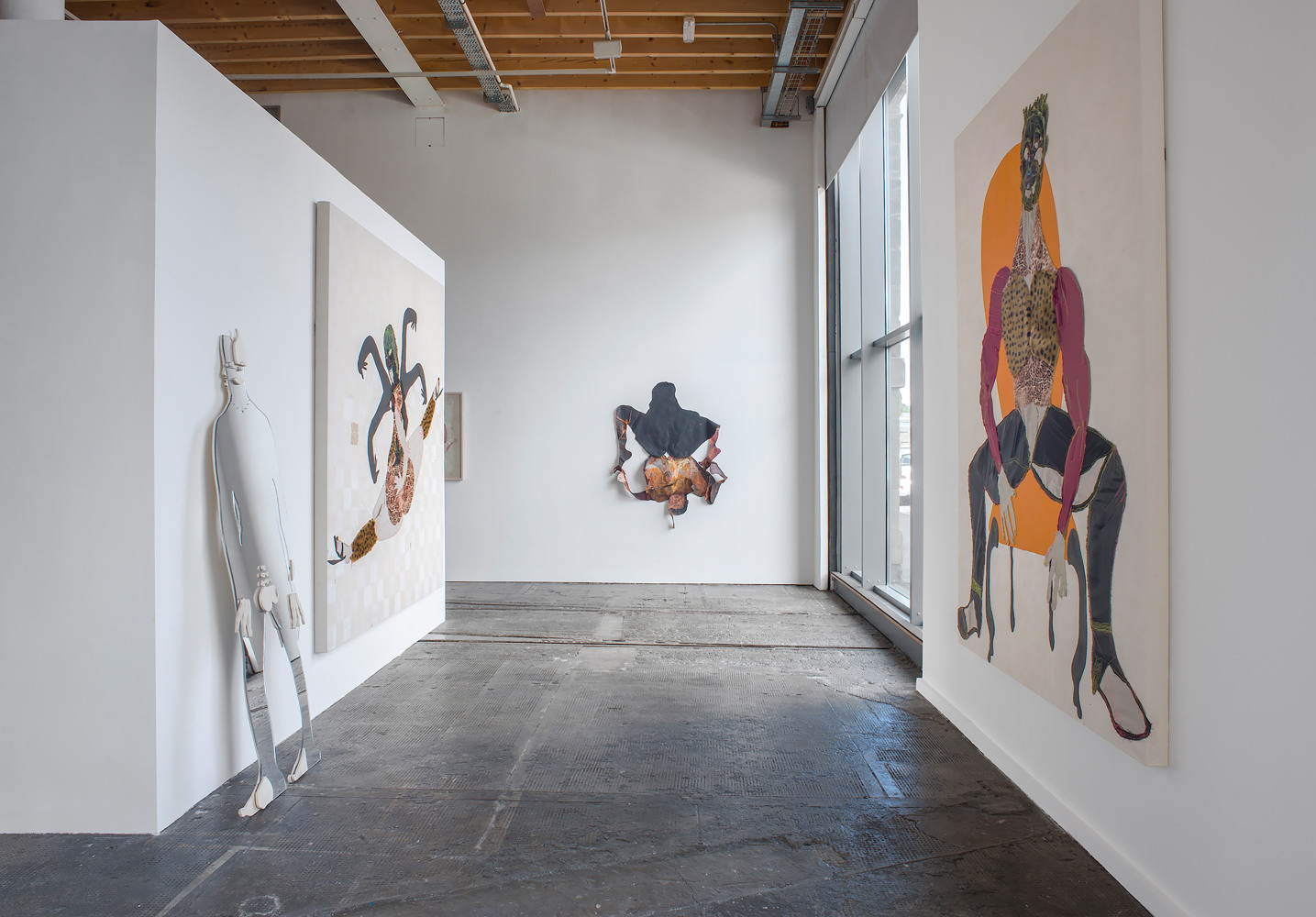 Installation view of paintings by Tschabalala Self