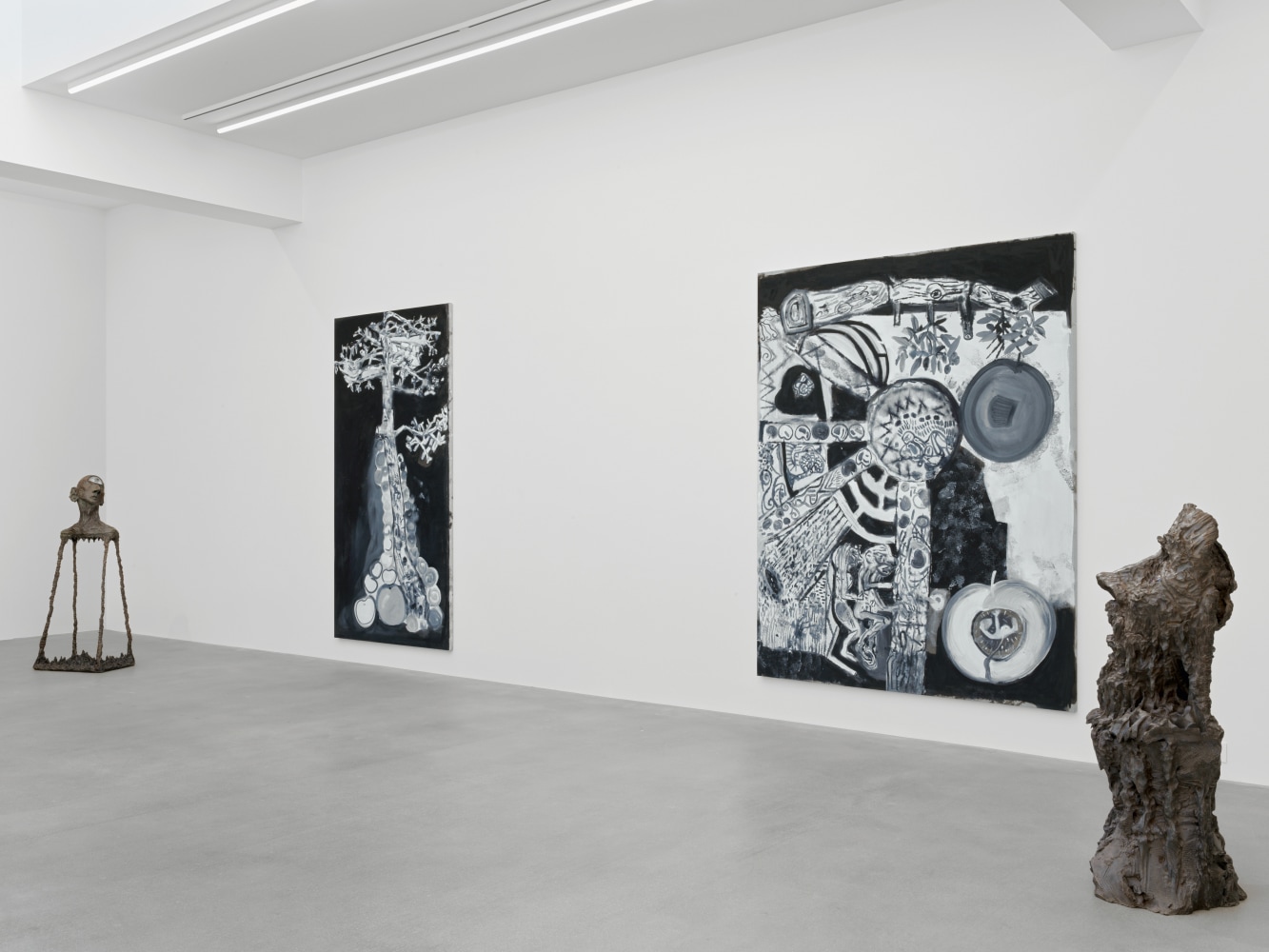 Installation view of group painting, print, and sculpture exhibition