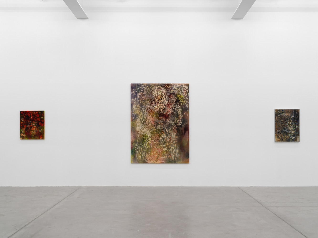 Installation view of Sam Falls paintings and ceramic reliefs exhibition