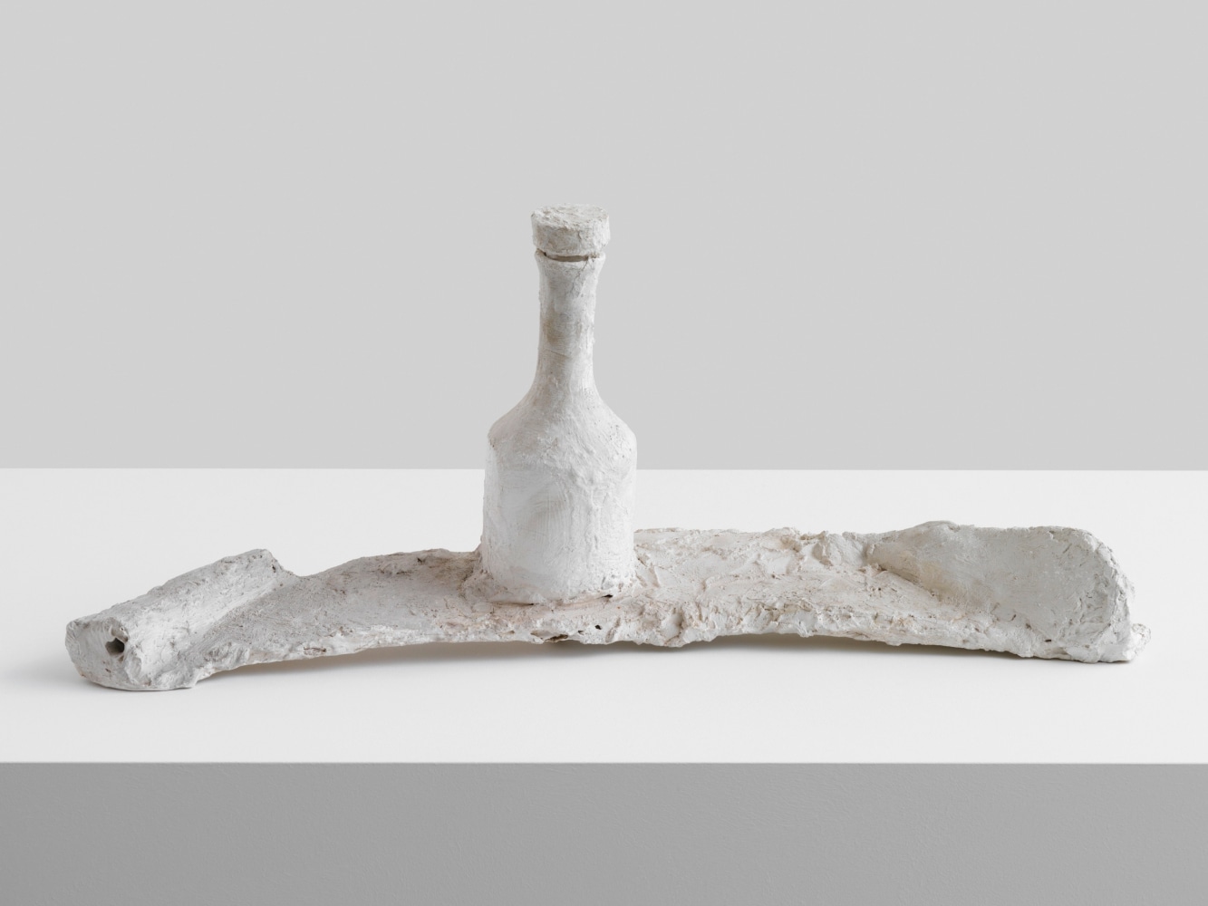 Labst&amp;uuml;ck

1985

Glass bottle, wood, gauze, plaster, dispersion

31 x 77 x 22 cm / 12 1/4 x 30 3/8 x 8 5/8 in

&amp;copy; Franz West Estate