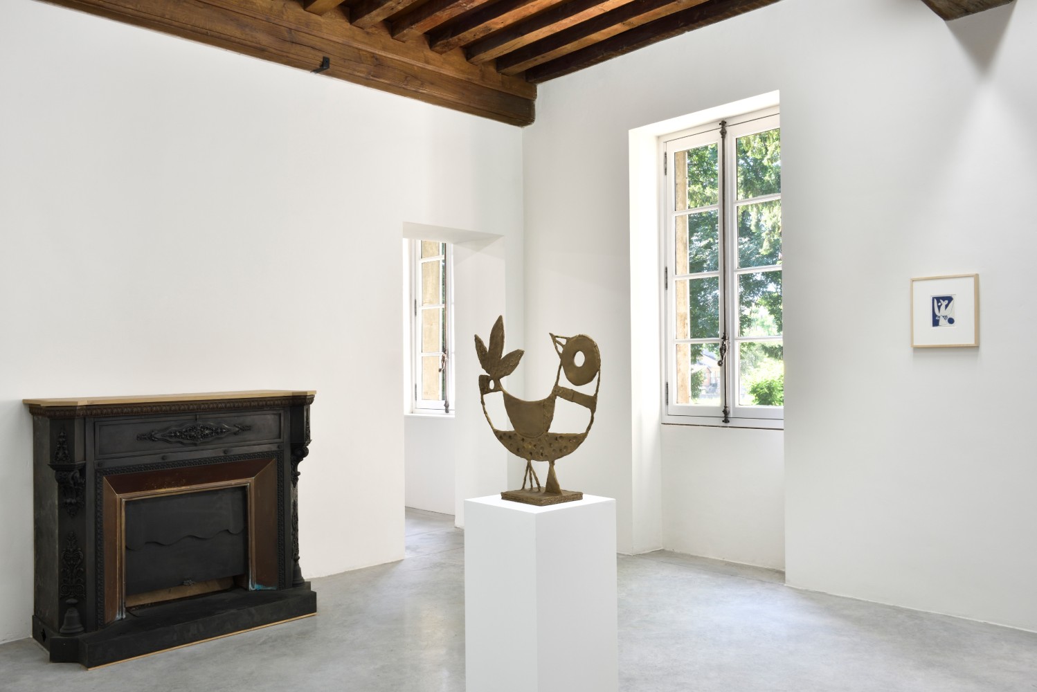 Installation view of paintings and sculptures by Austin Eddy