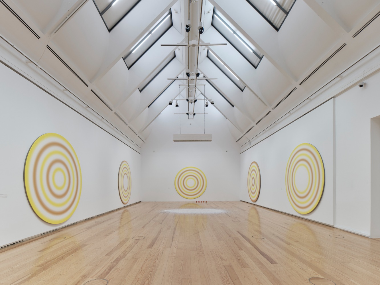 Installation view of paintings and sculptures by Ugo Rondinone