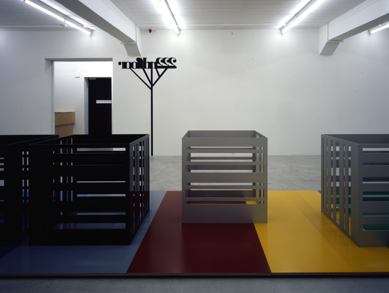 Installation view of Liam Gillick wall-based graphic work and sculpture exhibition