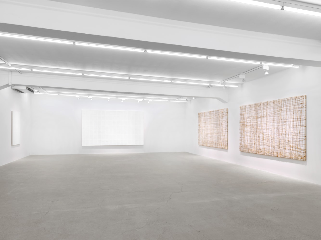 Installation view of Tim Rollins and K.O.S. paintings and text works exhibition