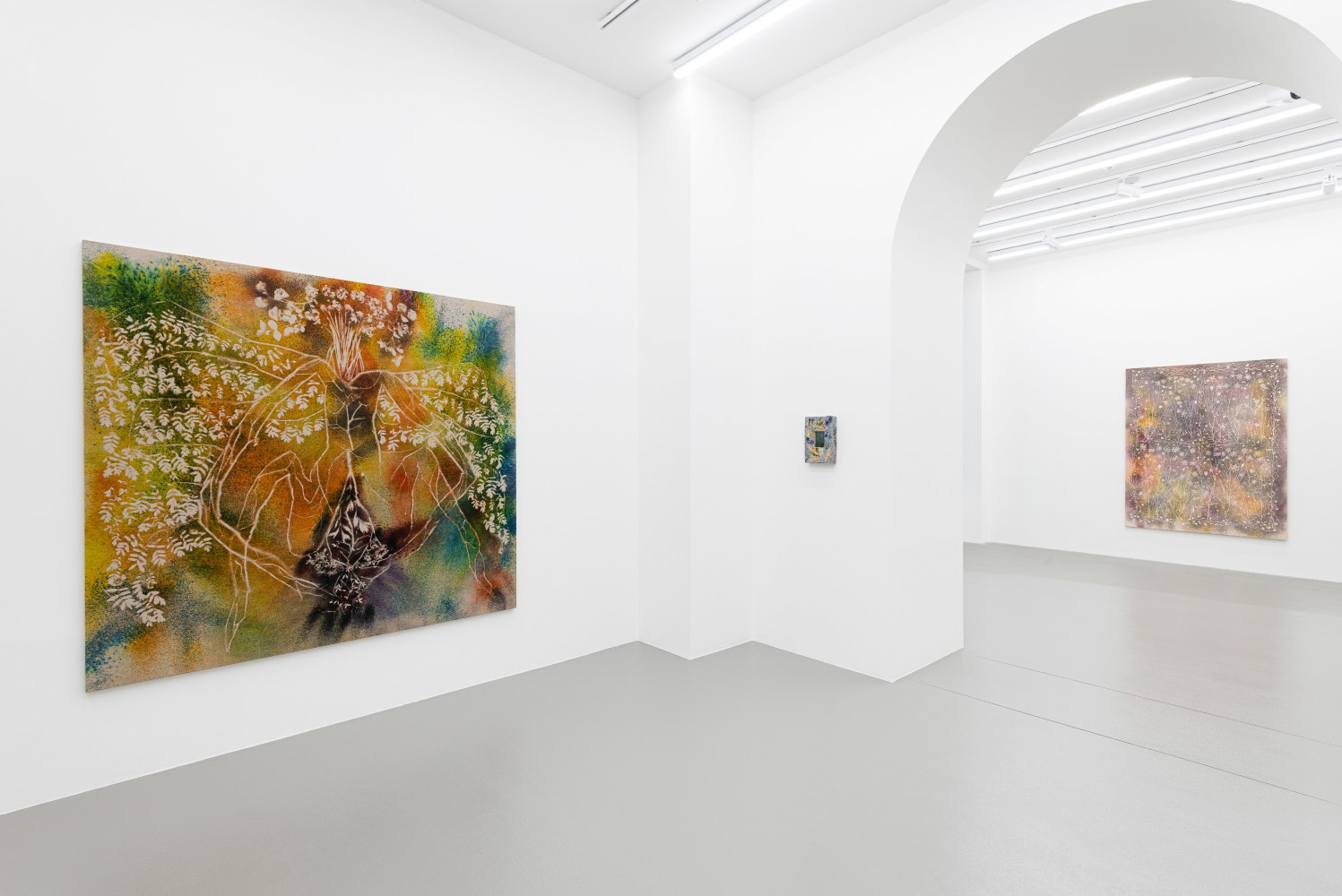 installation views of paintings and ceramic works by Sam Falls