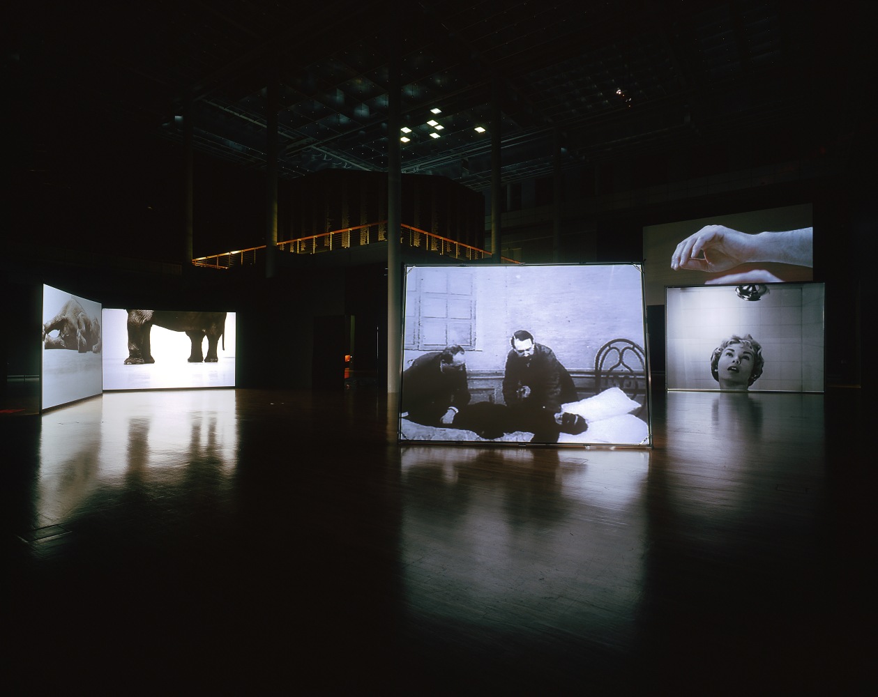 Installation view of video works by Douglas Gordon