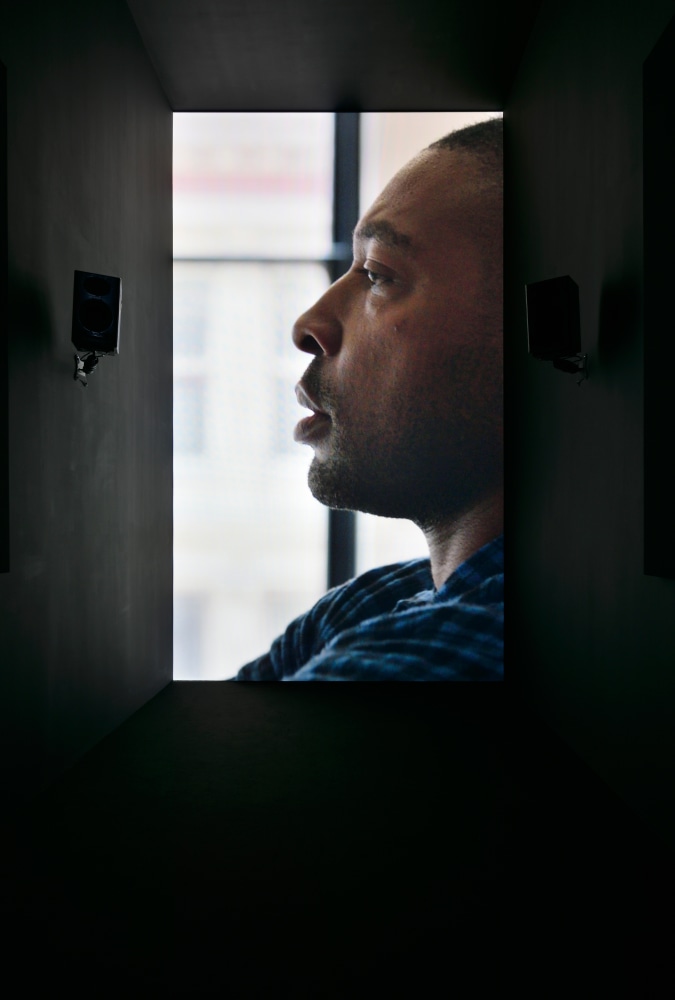 Installation view of video work by Adam Pendleton