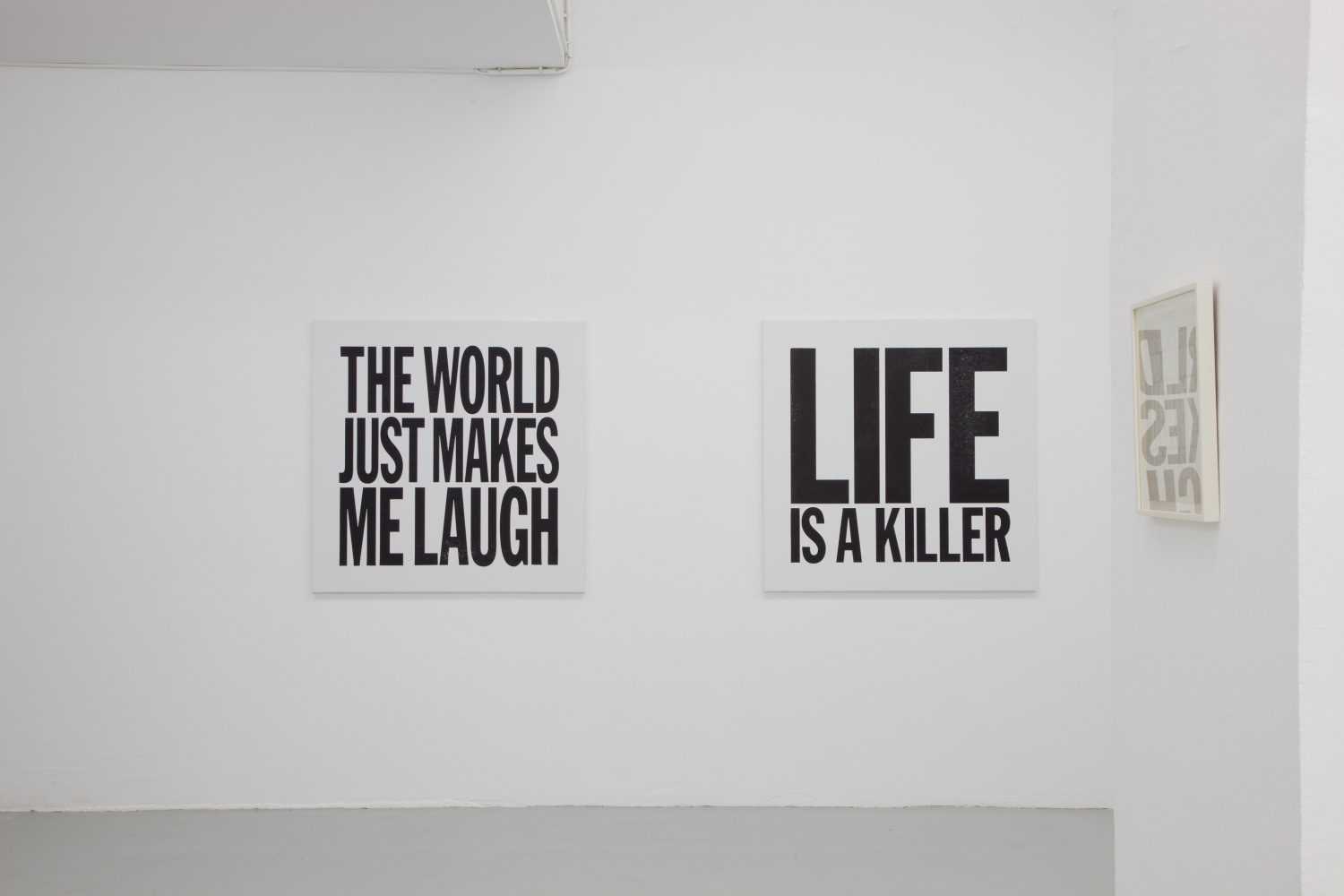 Installation view of wall works by John Giorno