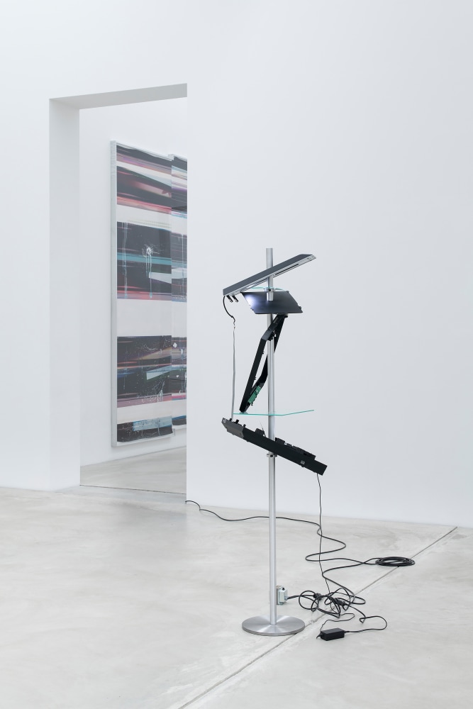 Installation view of a sculpture and a wall work by Walead Beshty