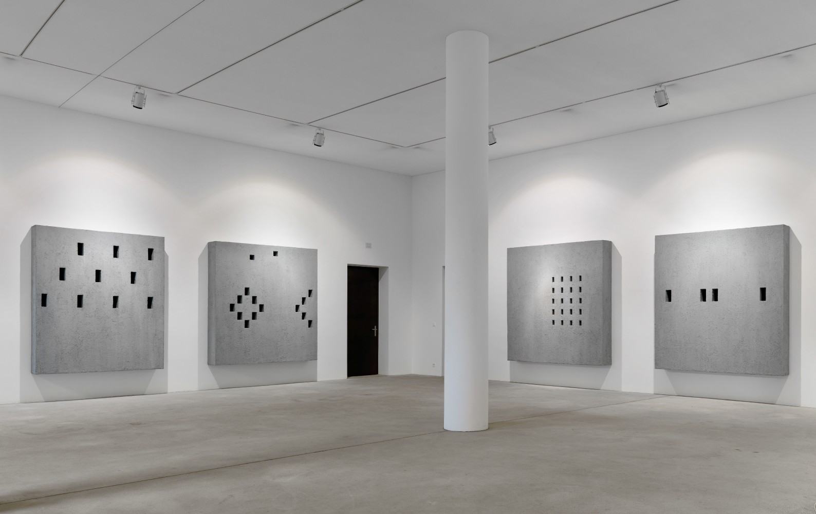 Installation view of wall works by Valentin Carron