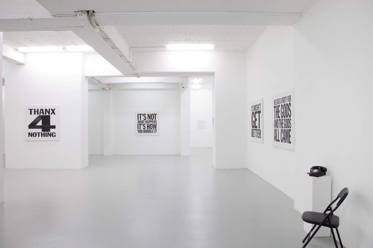 Installation view of wall works by John Giorno