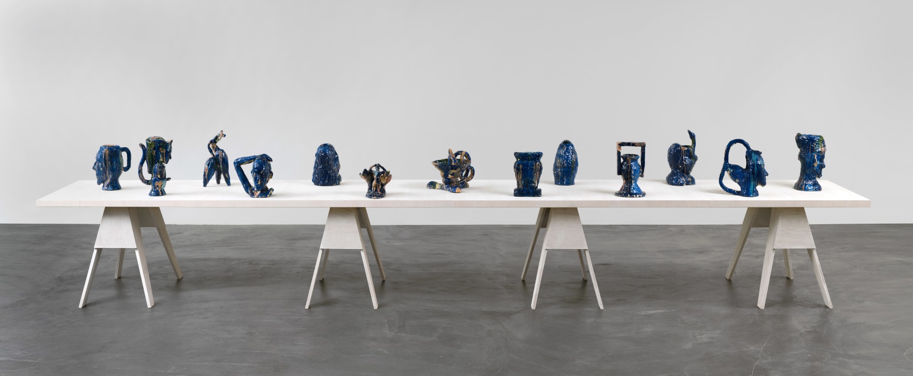 Group of sculptures by Andrew Lord on table