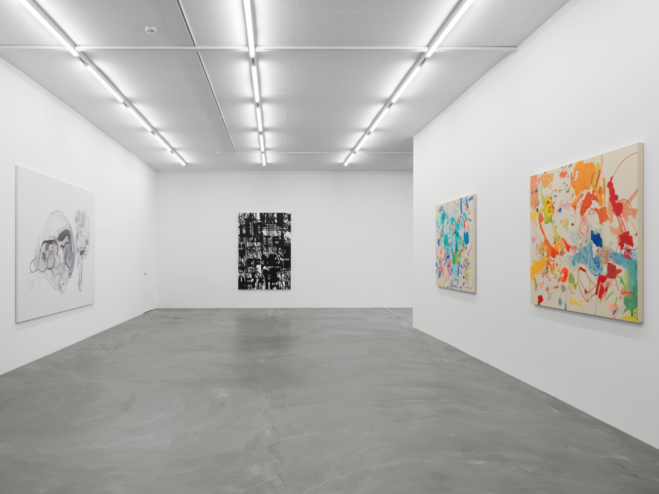 Installation view of group painting, photography, and sculpture exhibition
