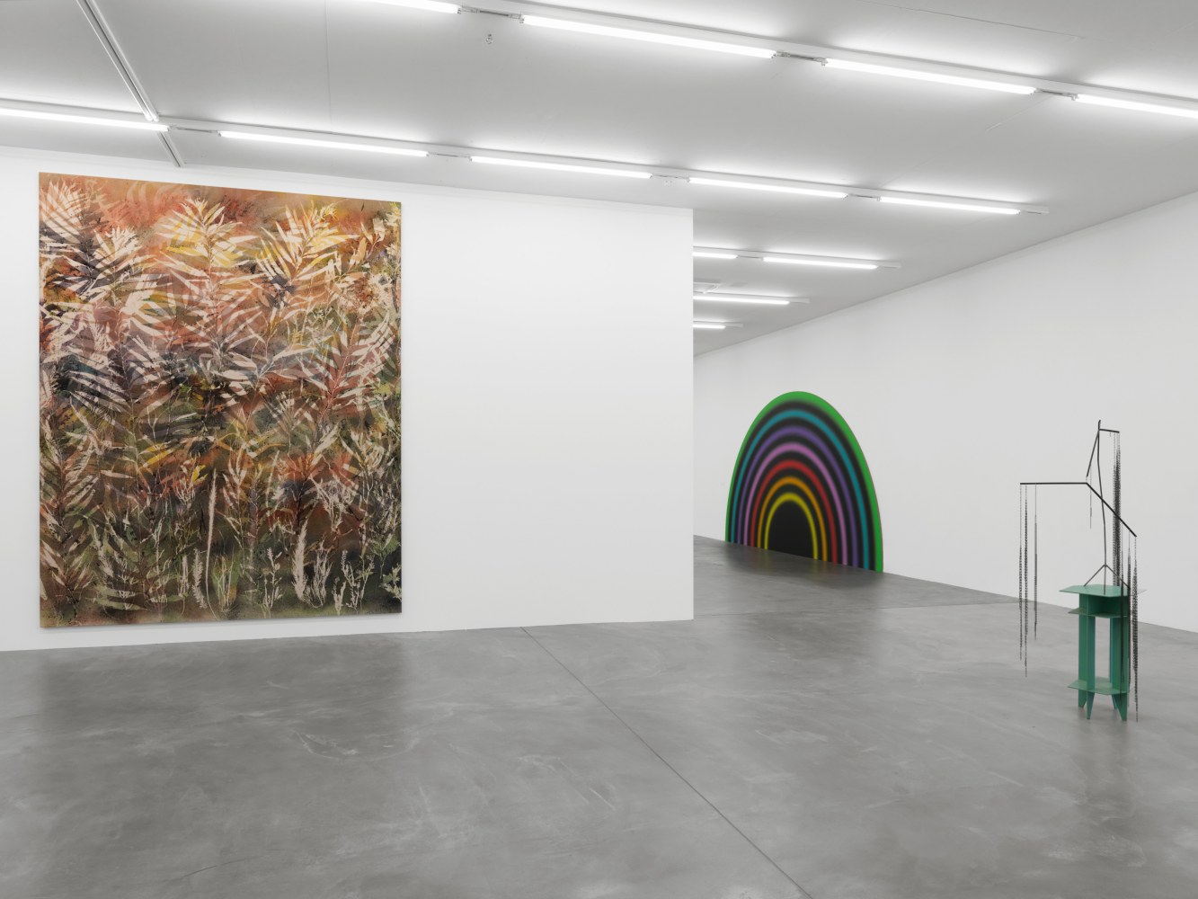 Installation view of group painting, photography, and sculpture exhibition