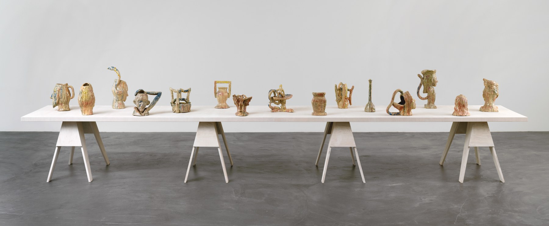Group of sculptures by Andrew Lord on table