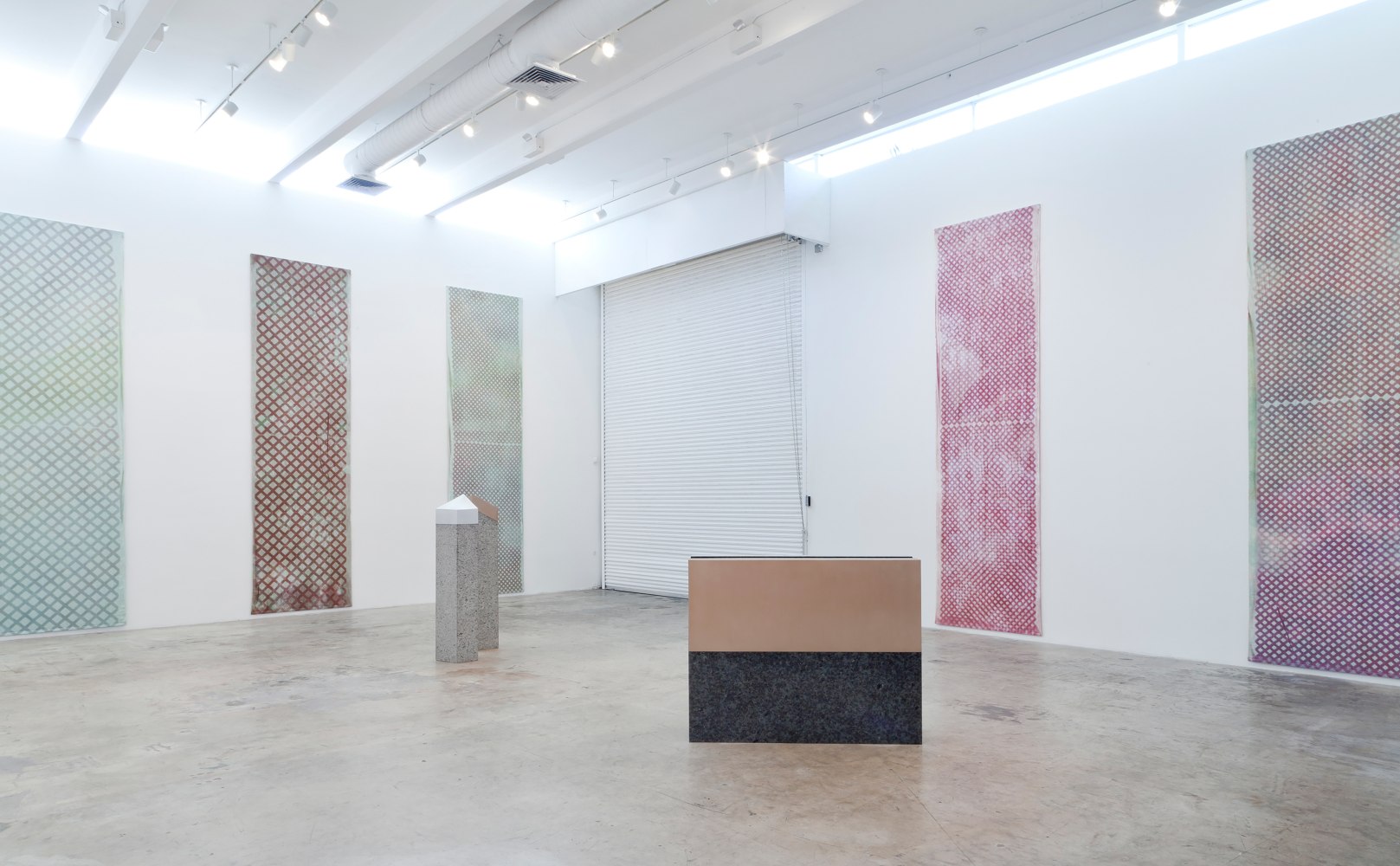 Installation view of paintings and sculptures by Sam Falls