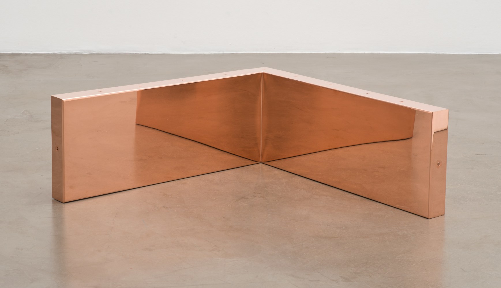 Walead Beshty Copper Surrogate (60&quot; x 120&quot; 48 ounce C11000 Copper Alloy, 90° Bend, 120&quot; Bisection/Section 10: June 1-8/August 30, 2016, Zurich, Switzerland; January 28/February 4, 2019, Geneva, Switzerland) 2016– Polished copper 29 x 76 x 76 cm / 11 1/2 x 30 x 30 in