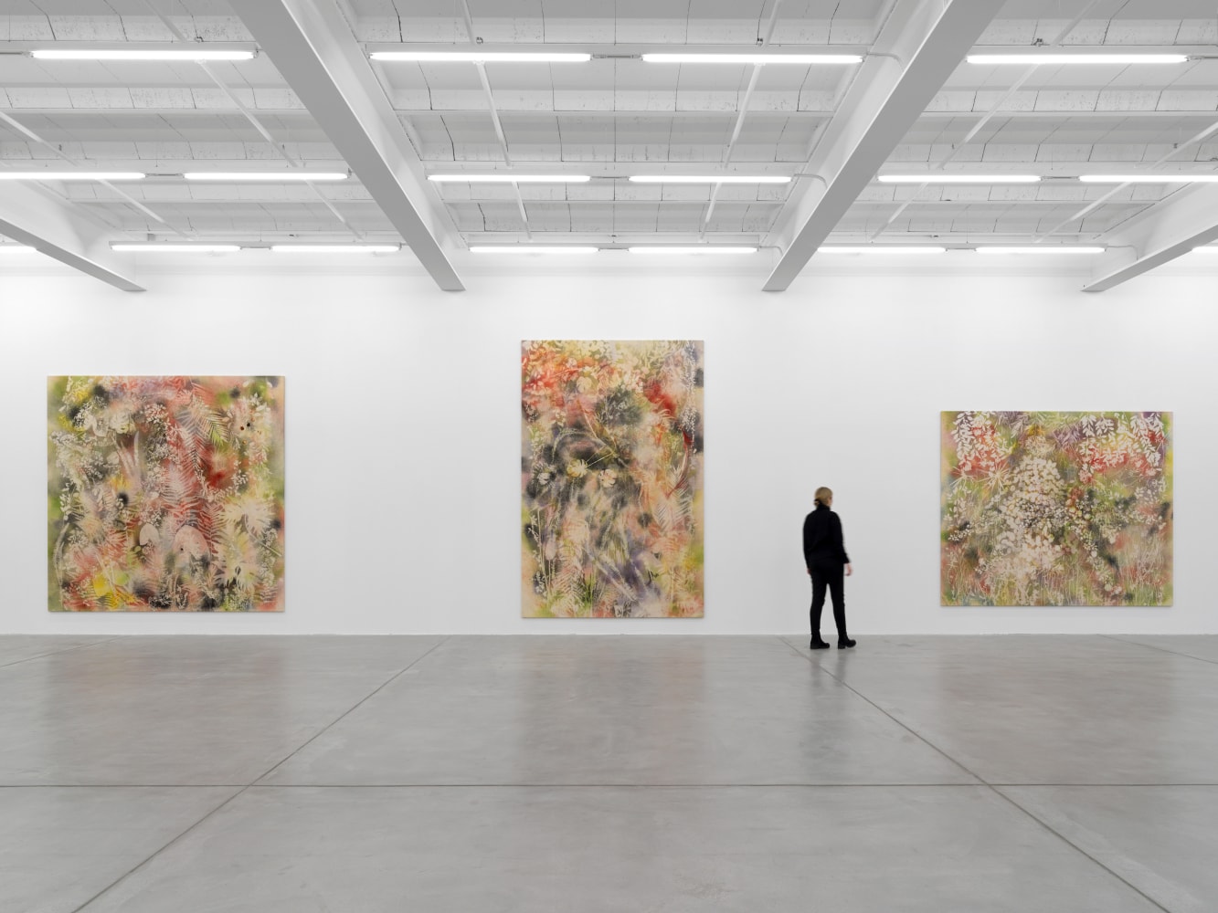 Installation view of Sam Falls paintings and ceramic reliefs exhibition