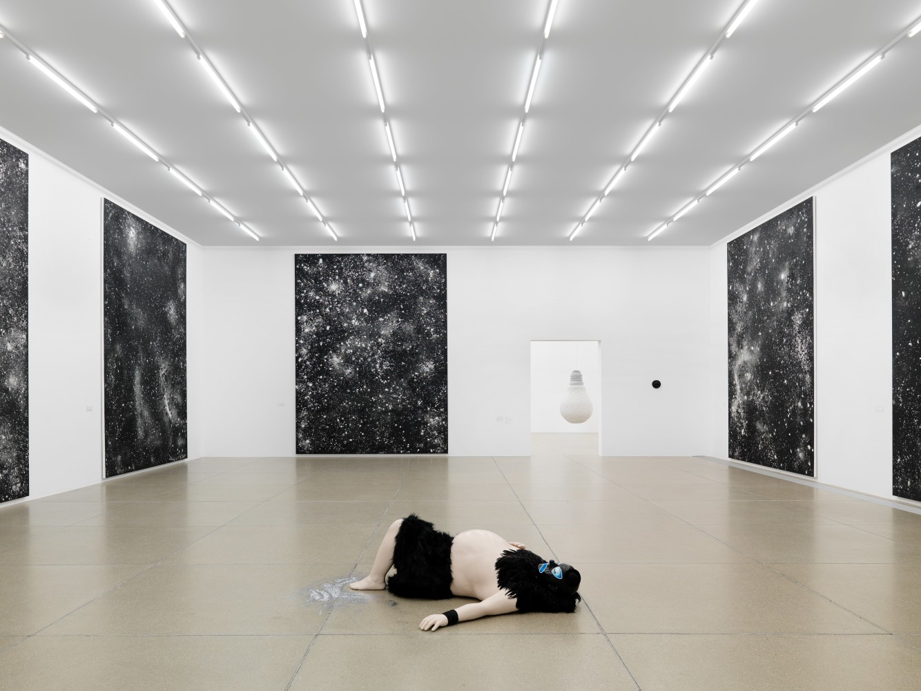 Installation view of sculptures and paintings by Ugo Rondinone