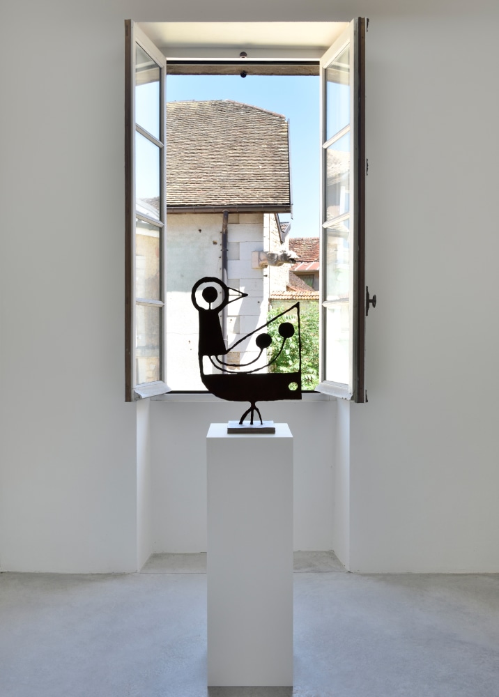 Installation view of paintings and sculptures by Austin Eddy