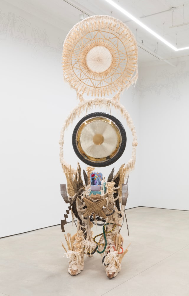Guadalupe Maravilla
Disease Thrower #8, 2019
gong, steel, wood, cotton, glue mixture, plastic, loofah, and objects collected from a ritual of retracing the artist&amp;#39;s original migration route
144 x 56 x 63 ins.
365.8 x 142.2 x 160 cm