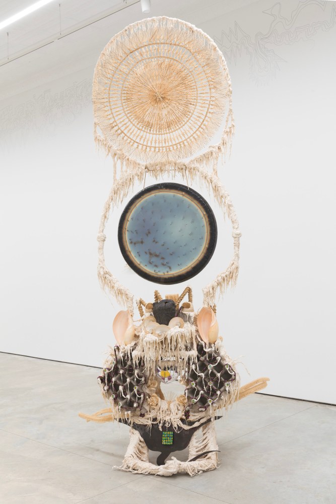 Guadalupe Maravilla
Disease Thrower #6, 2019
gong, steel, wood, cotton, glue mixture, plastic, loofah, and objects collected from a ritual of retracing the artist&amp;#39;s original migration route
144 x 56 x 63 ins.
365.8 x 142.2 x 160 cm