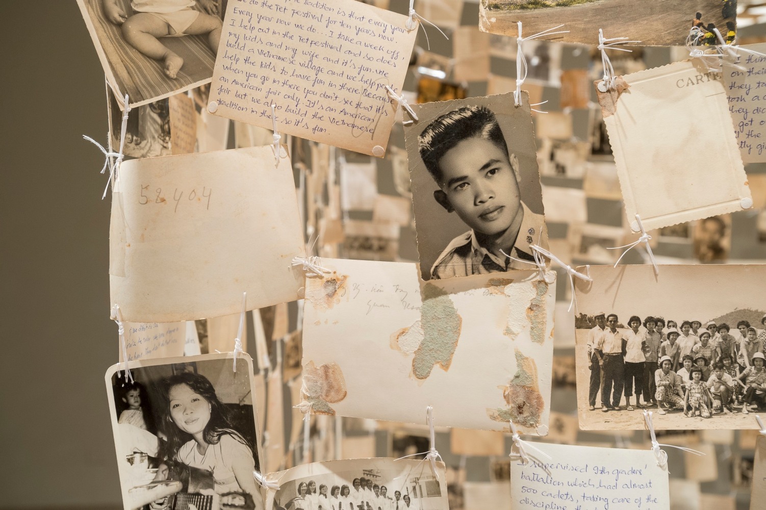 Dinh Q. L&amp;ecirc;
detail of Crossing the Farther Shore, 2014
found photographs, thread, and linen tape, seven parts
dimensions variable