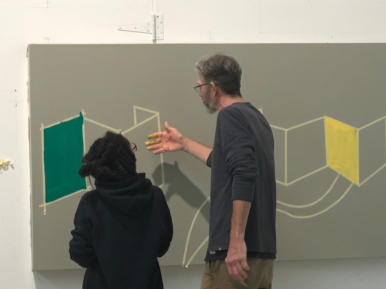 Student and Studio Manager Gene Benson discuss Al Held's process of drawing with tape.