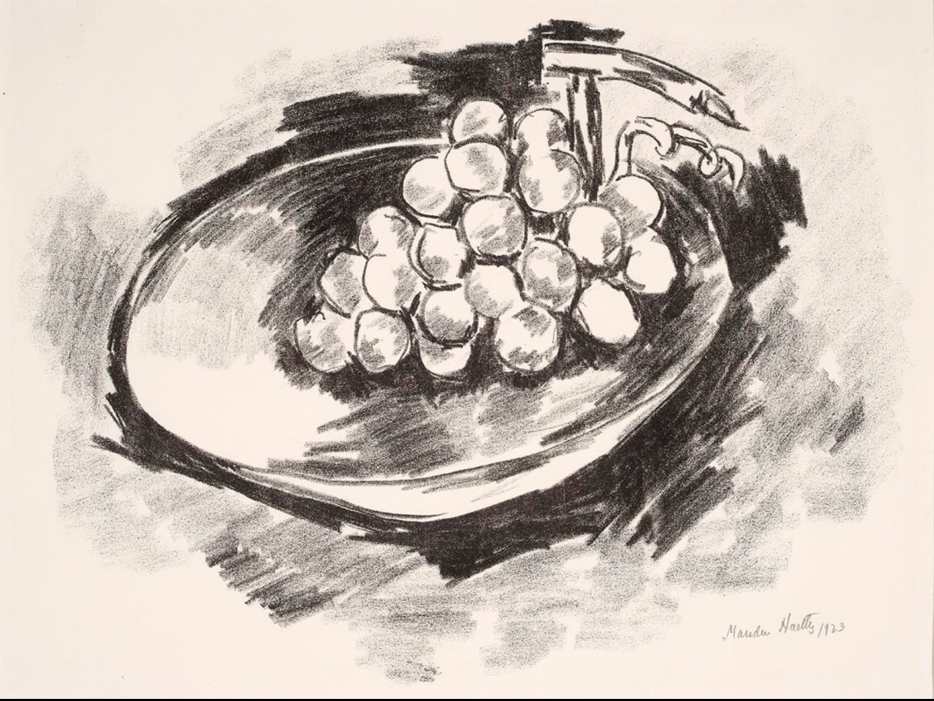 a lithograph of grapes in a bowl tilting forward to the left of the paper