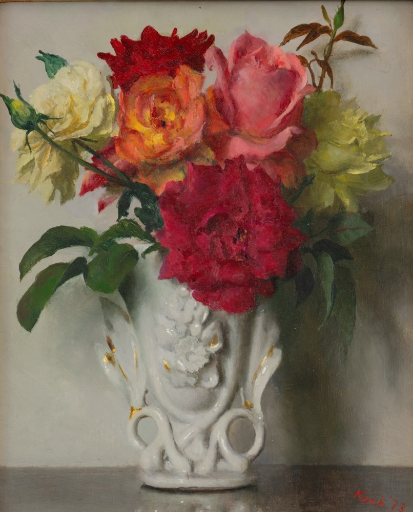 small bouquet of multi colored roses in an ornate milk glass vase