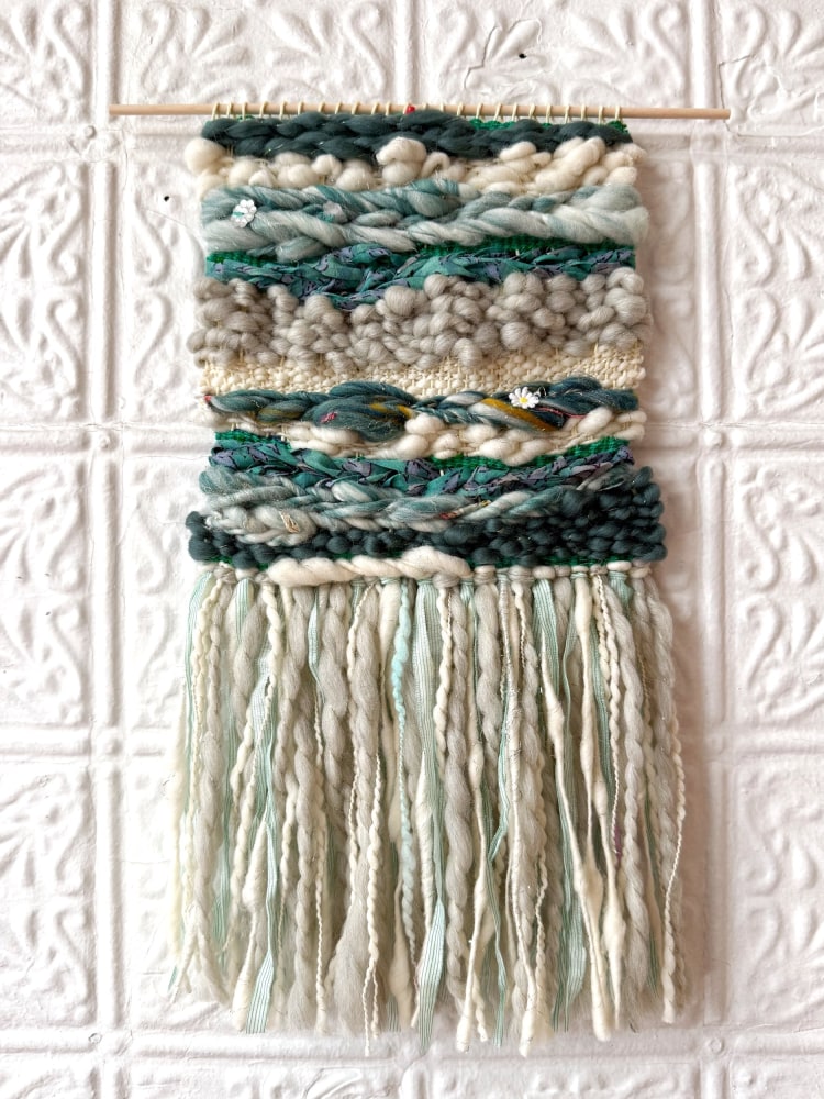weaving in different colored and textured yarns