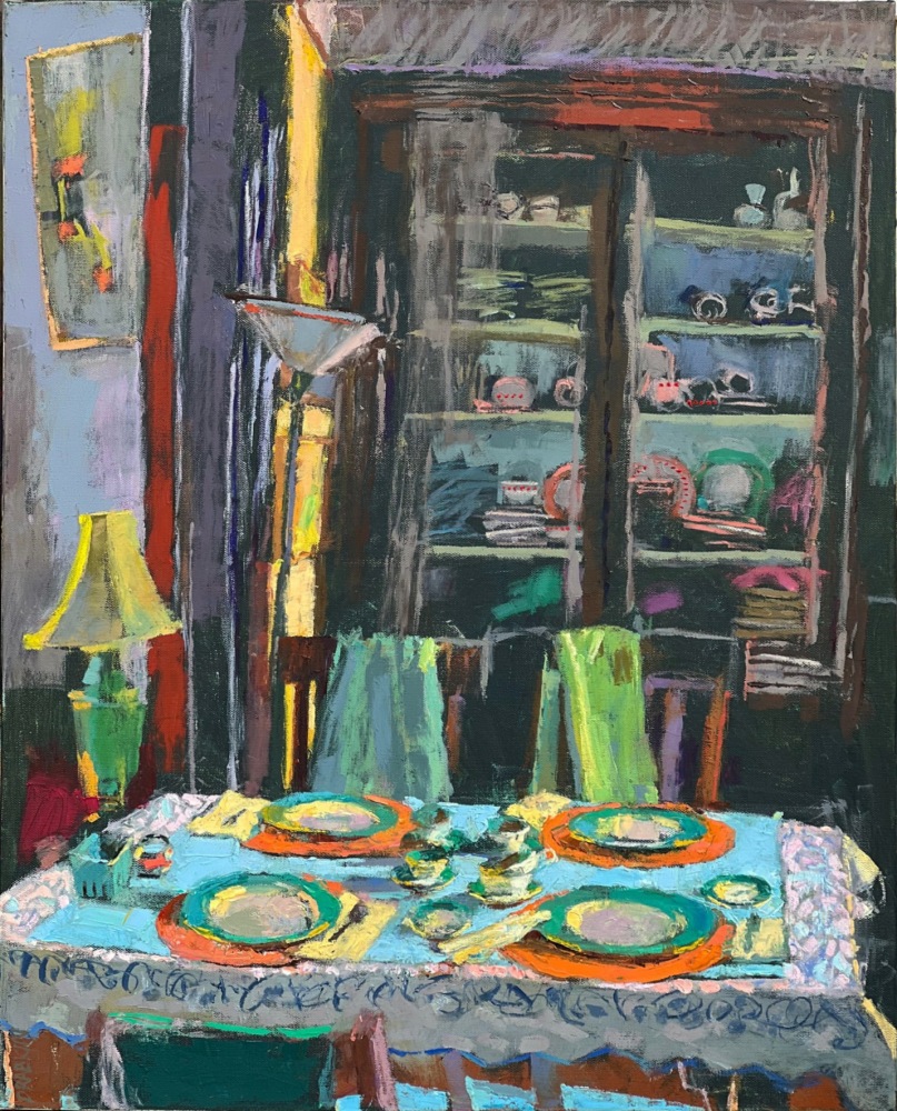 interior with bookshelves in the background and a table with plates