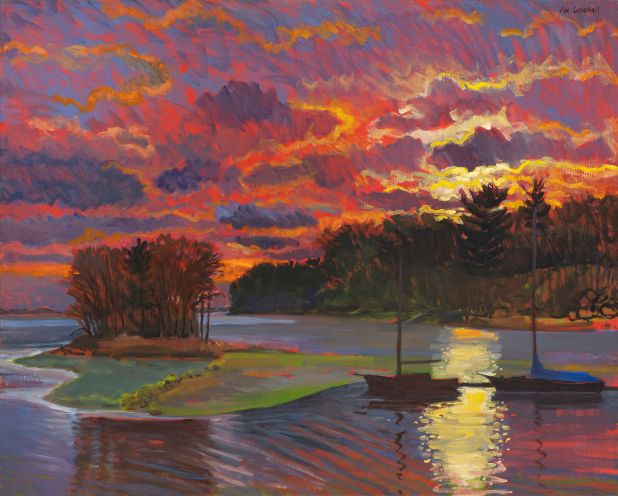 a cove at sunset with a little island and the sky vibrant reds, oranges pinks and some yellow