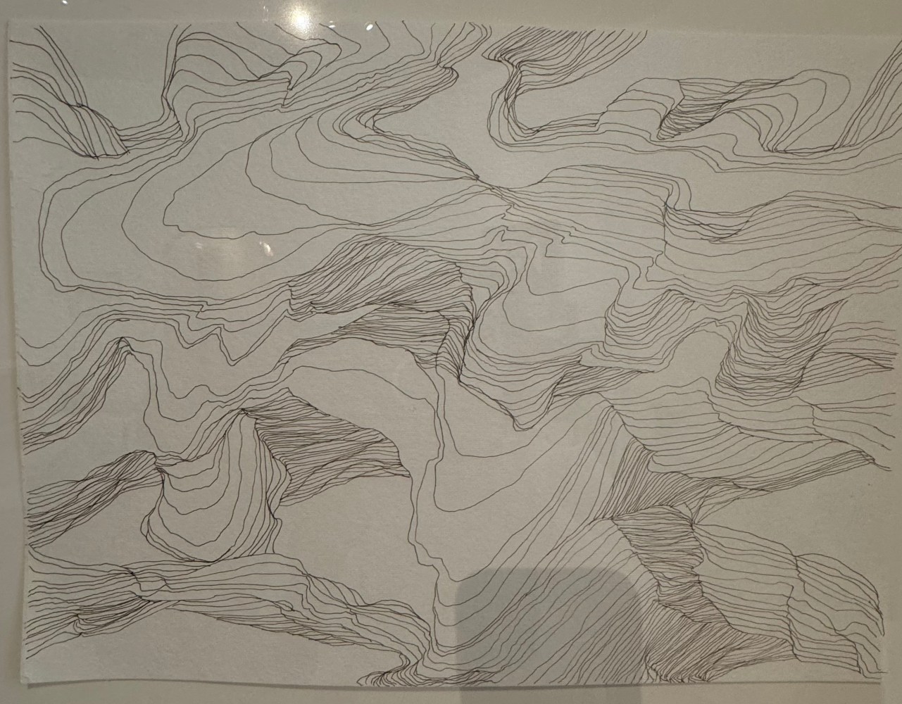 line drawing that looks like lines of sand on the shore