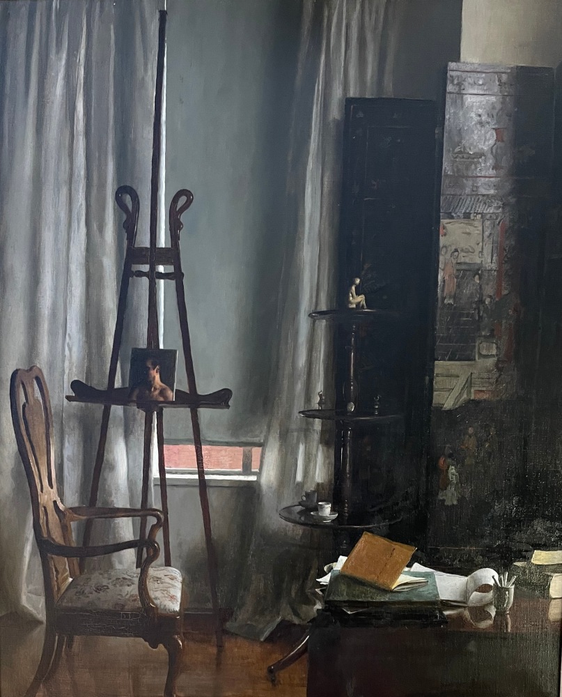interior of an artist's studio with an easel on the left, a painted screen on the right and a chair
