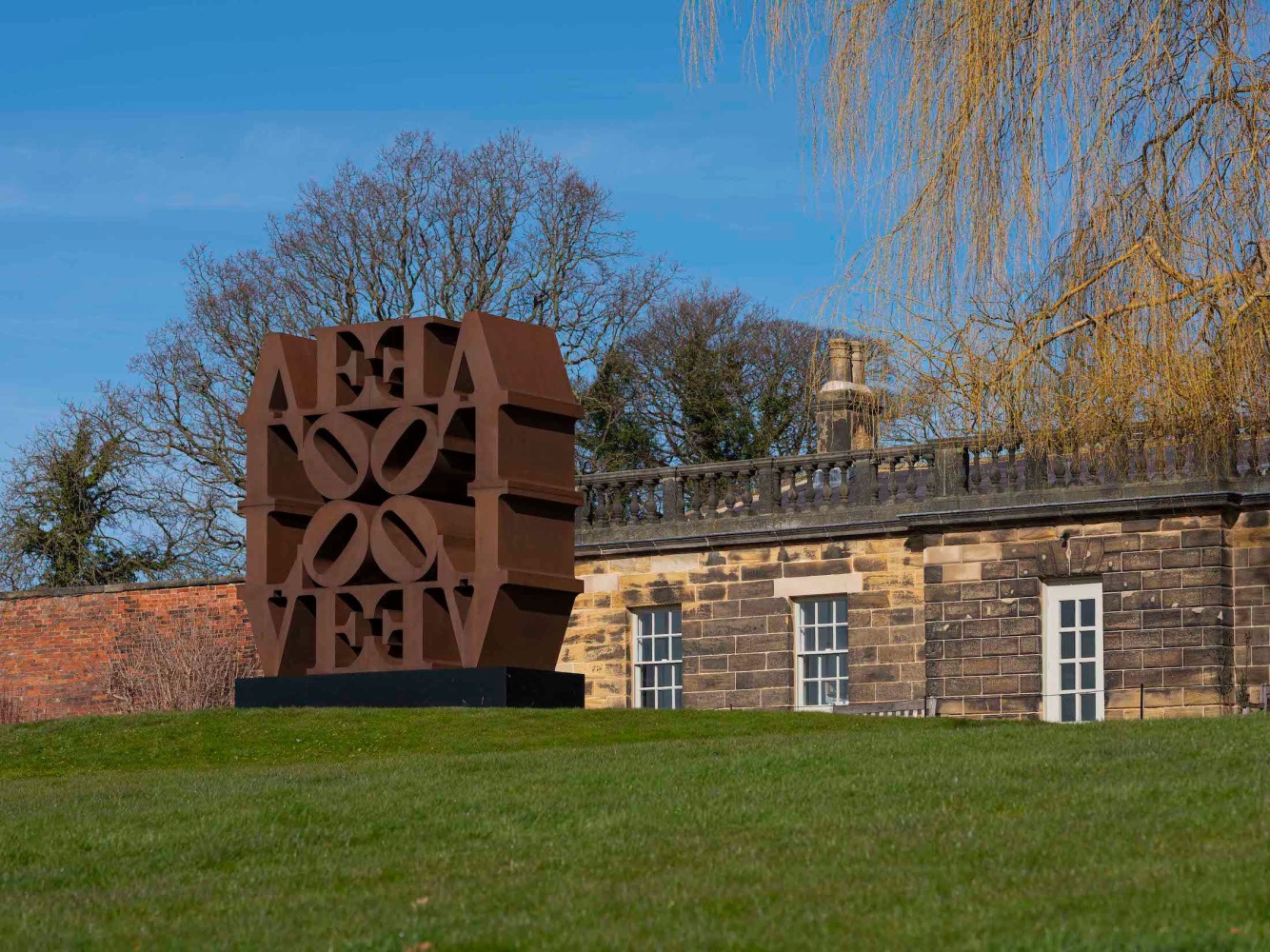 Robert Indiana's monumental Cor-Ten LOVE Wall on view at the Yorkshire Sculpture Park, 2022