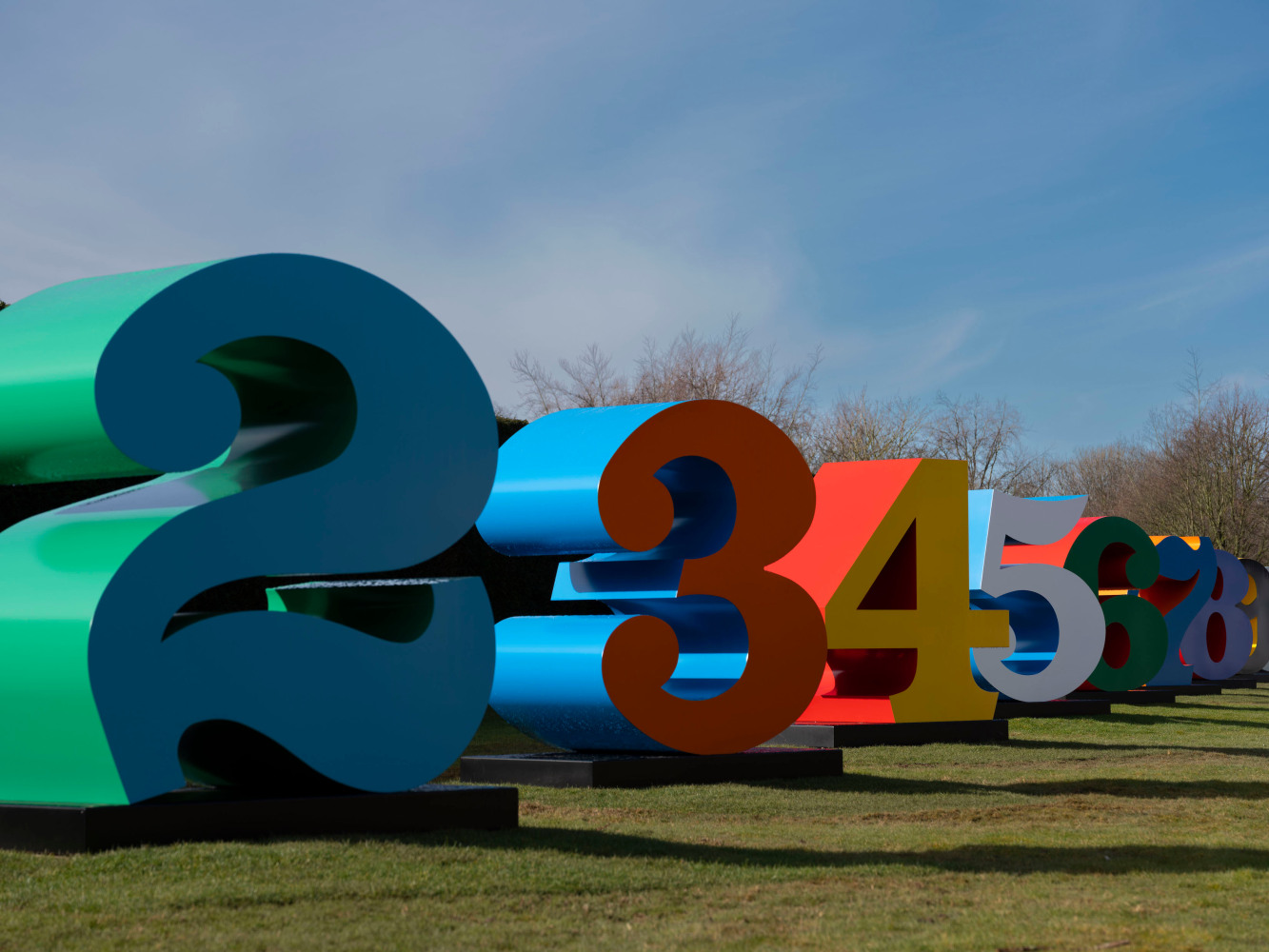 Installation view of Indiana's polychrome aluminum ONE Through ZERO (The Ten Numbers) at the Yorkshire Sculpture Park