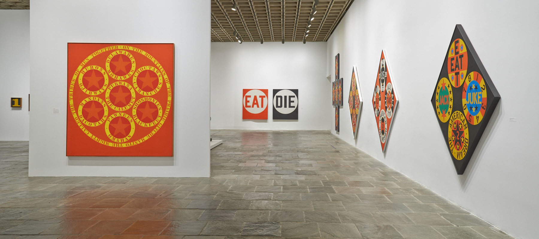 Installation view of Robert Indiana: Beyond LOVE, Whitney Museum of American Art, New York, September 26, 2013&amp;ndash;January 5, 2014. Left to right, The Calumet (1961), Eat/Die (1962), The Demuth American Dream No. 5 (1963), The Beware-Danger American Dream #4 (1963), The Red Diamond American Dream #3 (1962), and The Black Diamond American Dream #2 (1962). Photo: Tom Powel Imaging