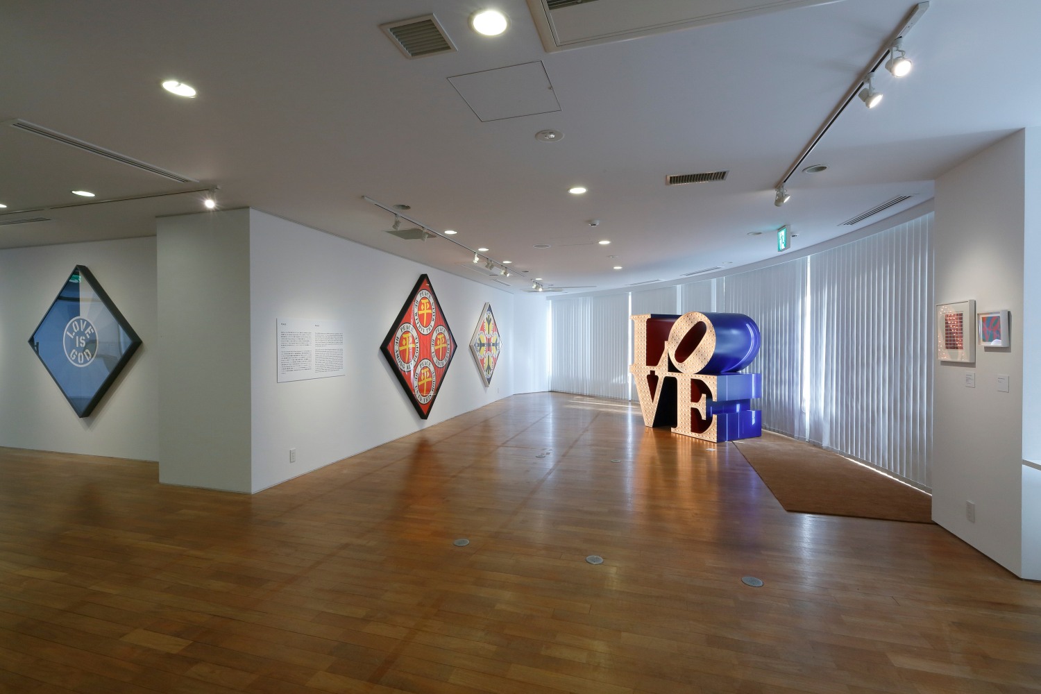 Installation view of Love &amp;amp; Peace: Robert Indiana Memorial Exhibition, Contemporary Art Foundation, Tokyo, November 27&amp;ndash;December 2, 2018. Left to right, Love Is God (1964), Four Diamond Ping (2003), Four Diamond Peace (2003), and The Electric LOVE (1966&amp;ndash;2000)