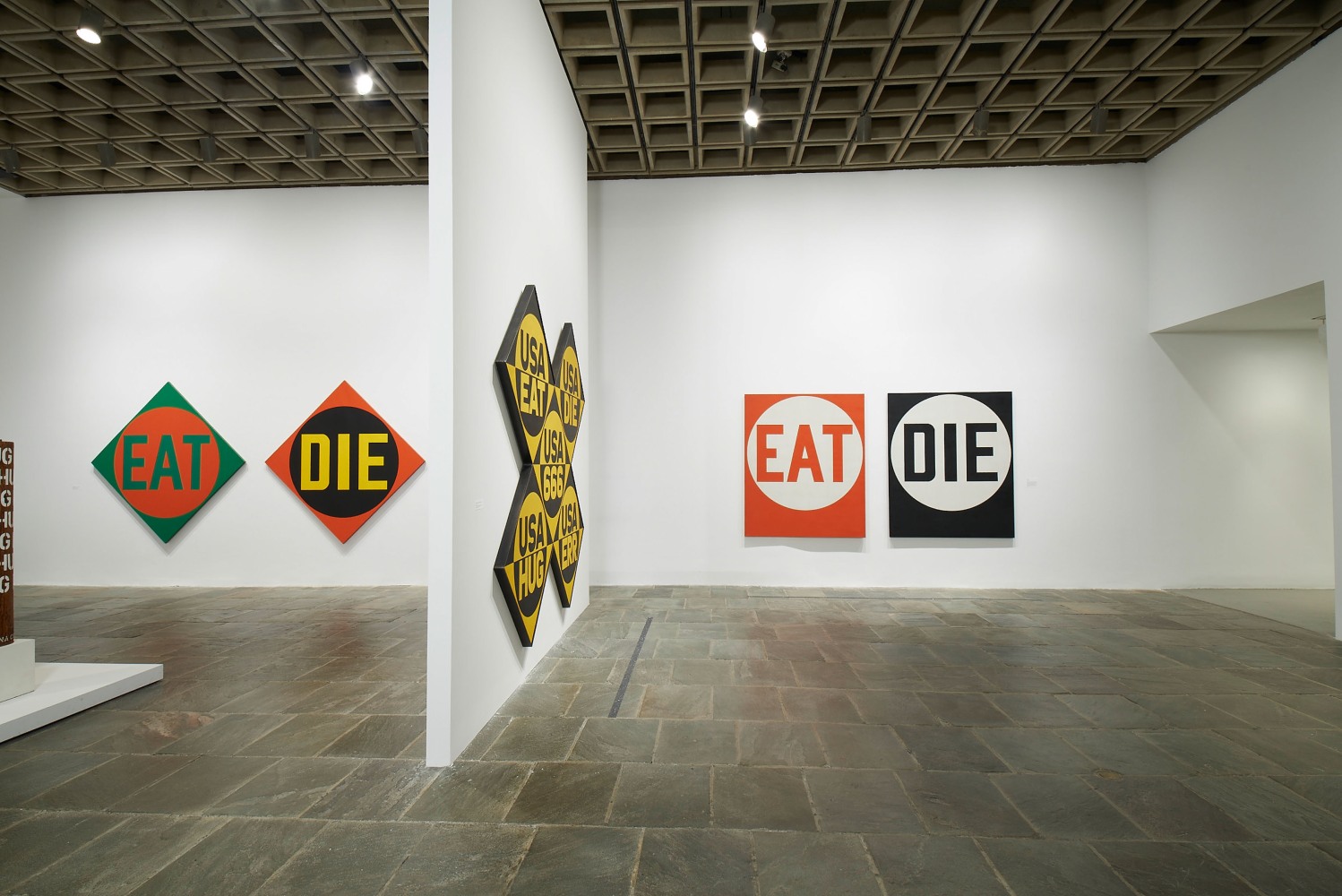 Installation view of&amp;nbsp;Robert Indiana: Beyond LOVE, Whitney Museum of American Art, New York, September 26, 2013&amp;ndash;January 5, 2014. Left to right, The Green Diamond EAT/The Red Diamond DIE (1962), USA 666 (The Sixth American Dream) (1964&amp;ndash;66), and&amp;nbsp;Eat/Die (1962). Photo: Tom Powel Imaging