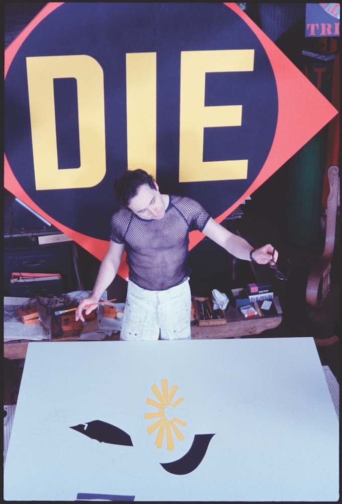 Robert Indiana works on the &amp;ldquo;A Mother is a Mother&amp;rdquo; panel from Mother and Father&amp;nbsp;(1963&amp;ndash;66) with &amp;ldquo;The Red Diamond Die&amp;rdquo; (1962) in the background. Photo:&amp;nbsp;&amp;copy; William John Kennedy/Courtesy of kiwiartsgroup.com