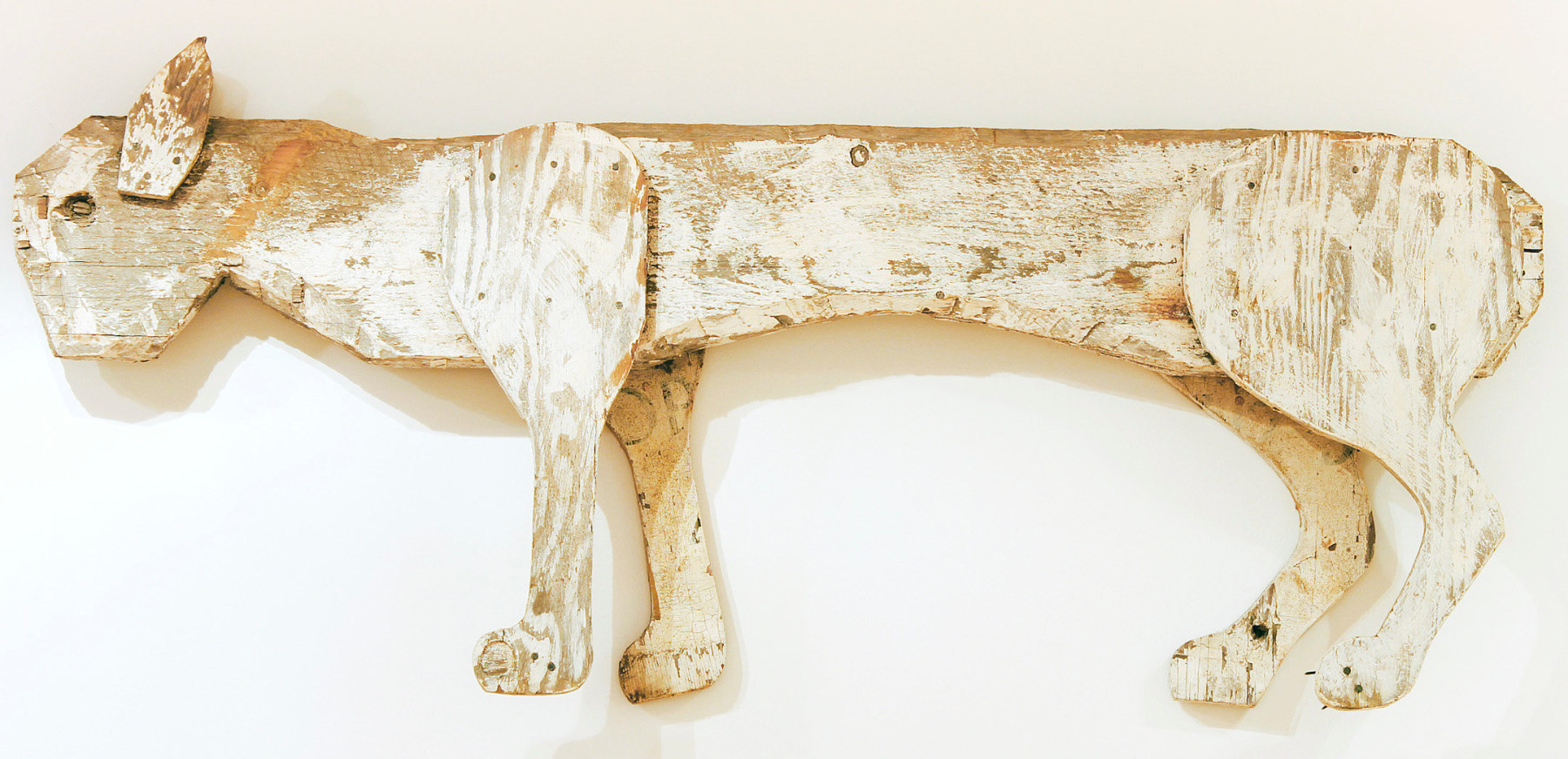 Wooden sculpture of an abstracted cat