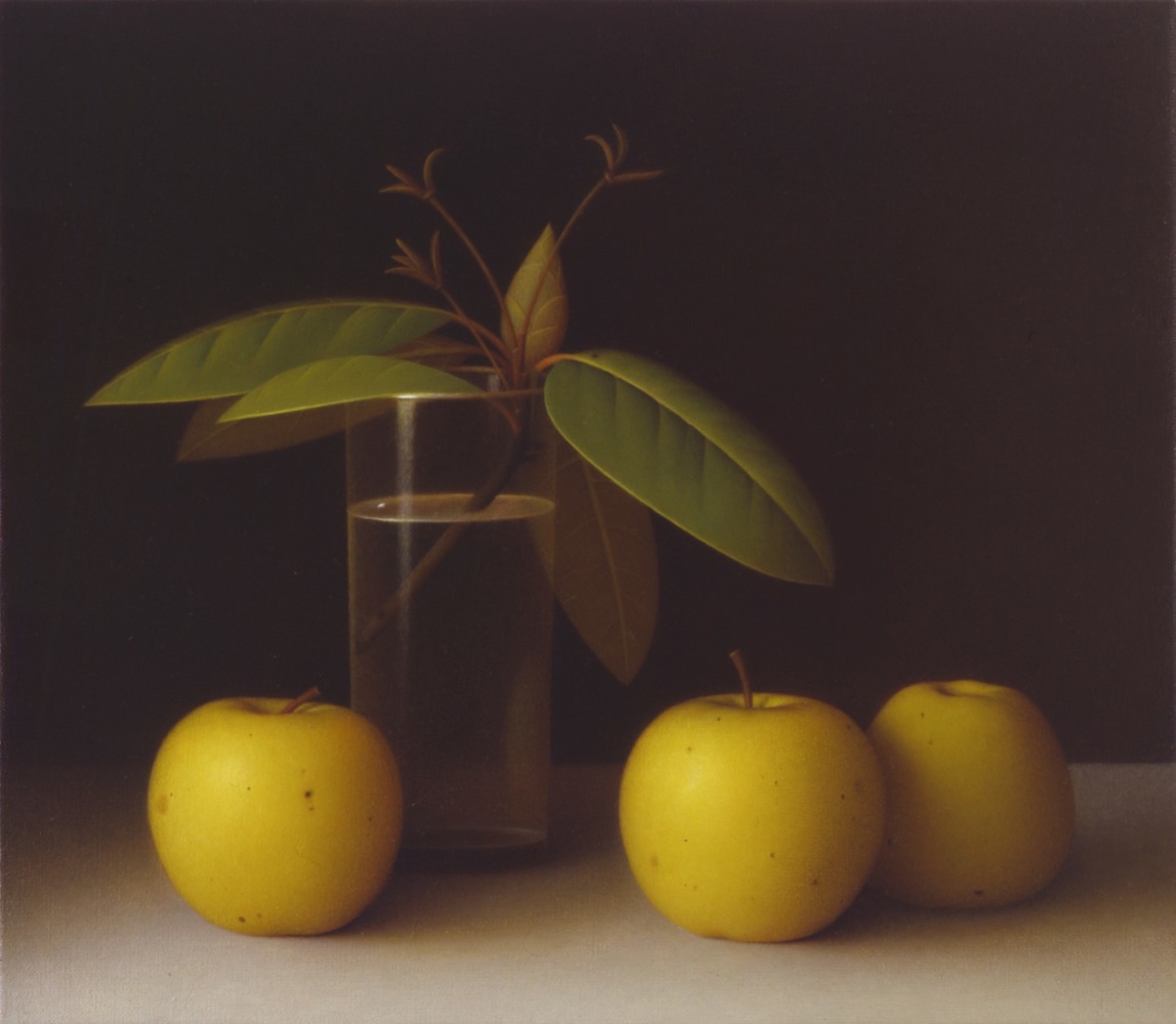 Still life painting of three yellow apples sitting on a grey table, with a cutting from a tree sitting in a glass of water behind them