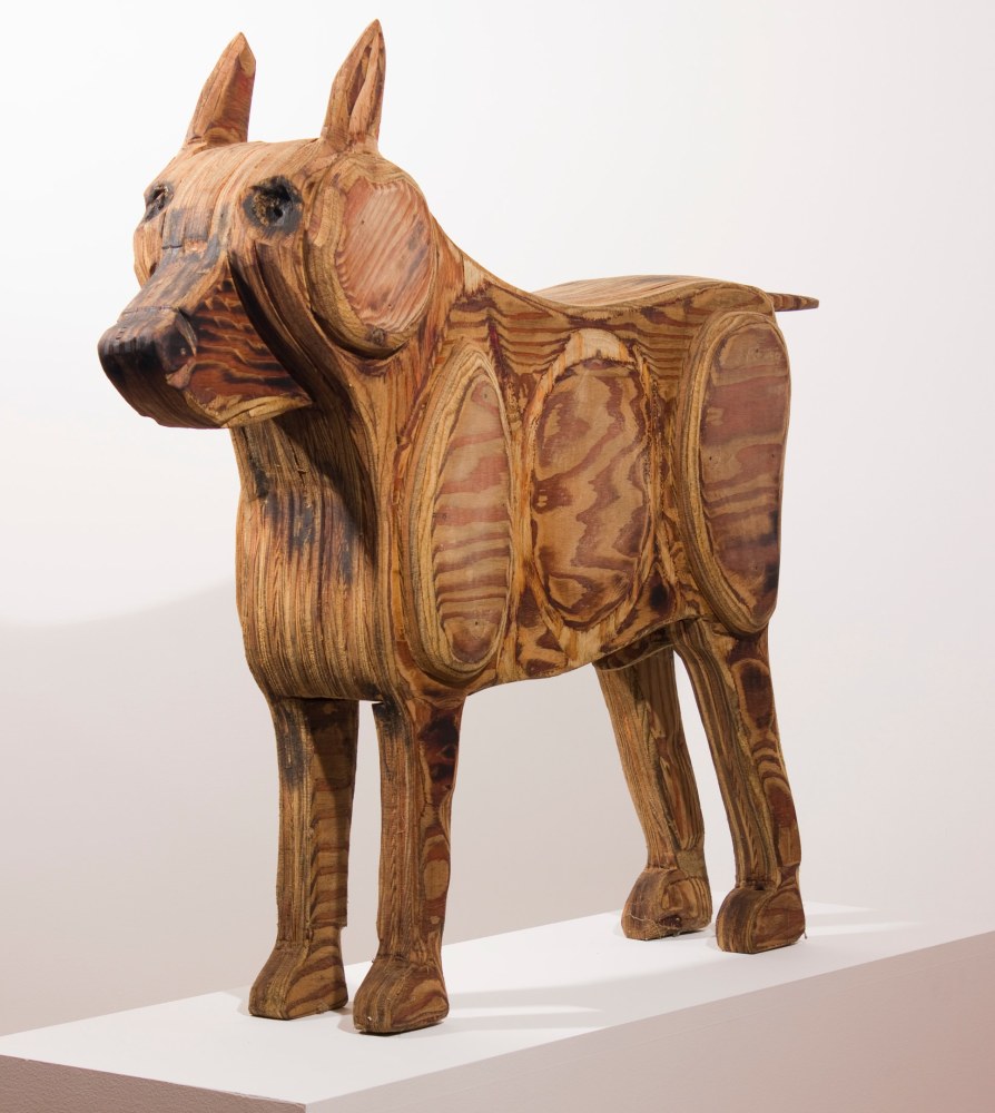 Wood sculpture of a dog